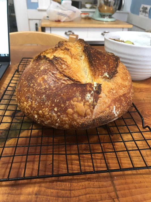 side angle of sourdough loaf in kitchen